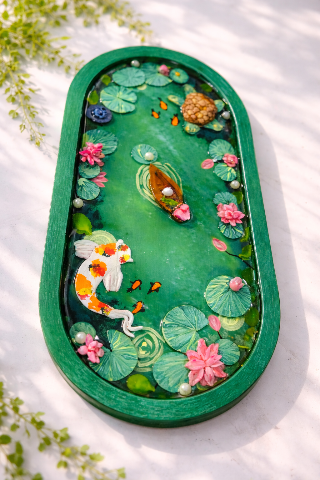 Handmade koi pond resin tray featuring lotus flowers and koi fish, designed as a decorative jewelry tray and home decor piece