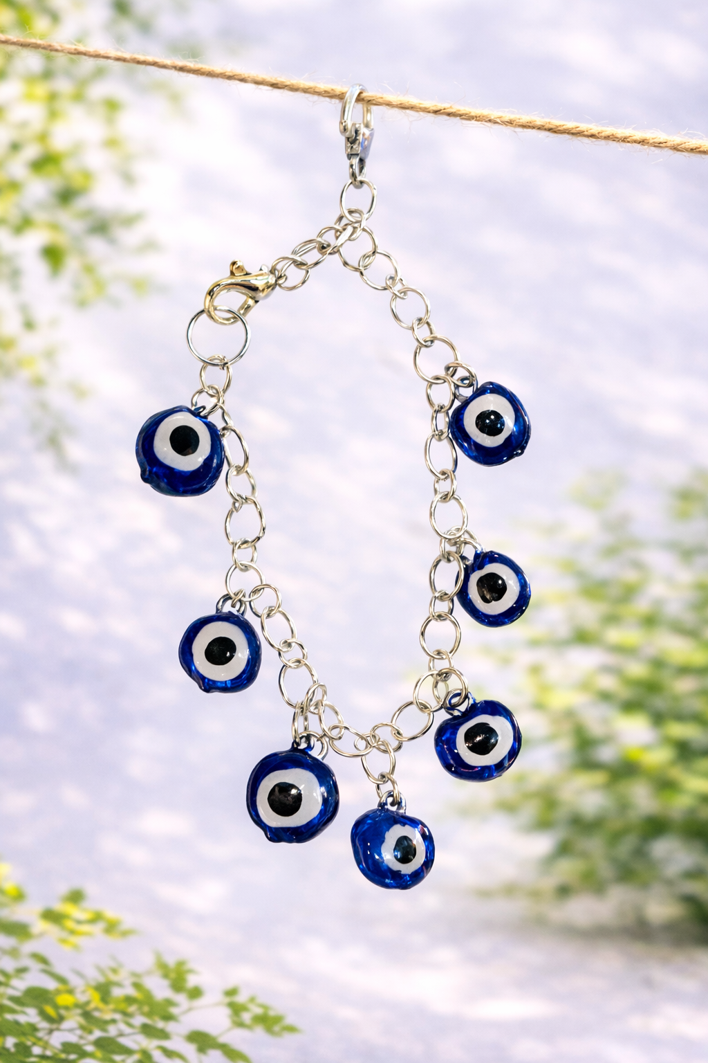 Handmade blue evil eye charm bracelet designed as a stylish nazar protection accessory and meaningful everyday jewelry