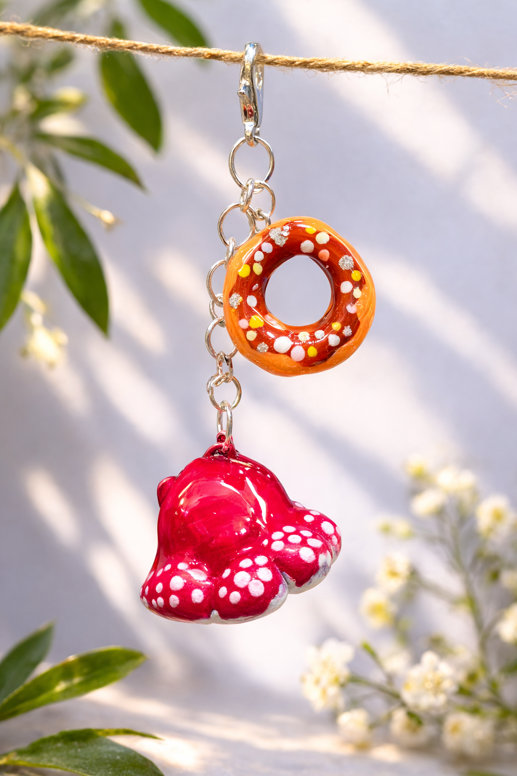 Handmade donut and mushroom clay keychain set designed as kawaii bag charms and friendship gifts