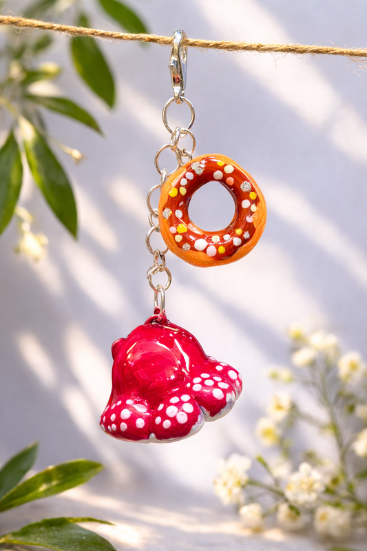 Handmade donut and mushroom clay keychain set designed as kawaii bag charms and friendship gifts