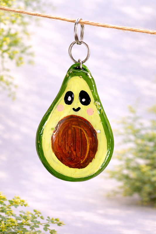 Handmade kawaii avocado clay keychain designed as a cute bag charm and playful everyday accessory