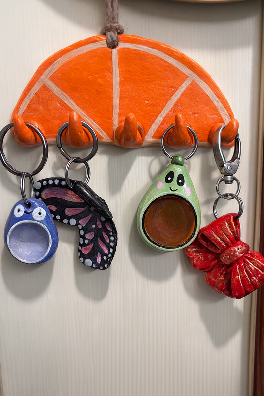 Handmade orange slice clay wall key holder with five hooks for keys, keychains and cute kitchen decor